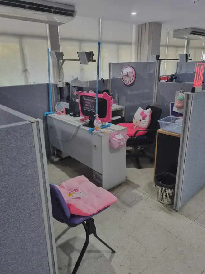 &ldquo;Back down on the first floor, at the pink desk, receiving my new Thai drivers license&rdquo;